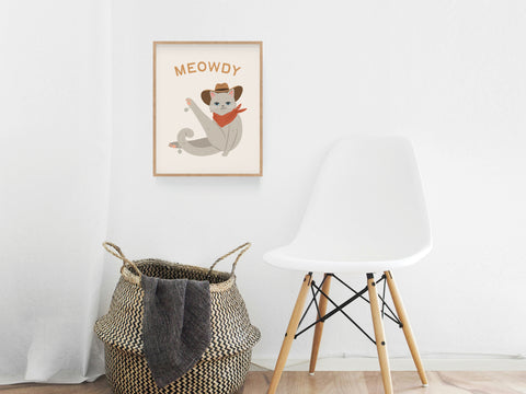 The Meowdy Cat Art Print by Onderkast Studio, showing a cat in a cowboy hat and red bandana, is ideal feline wall decor for cat lovers looking to add playful art to their minimalist space.