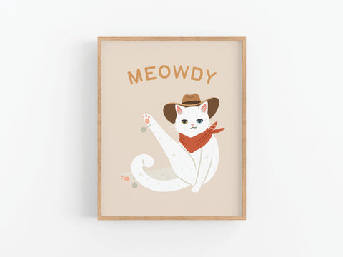 The Meowdy Cat Art Print by Onderkast Studio features a white cat in a cowboy hat and bandana with “MEOWDY” above. This charming art print on a light beige background is perfect for cat lovers!.