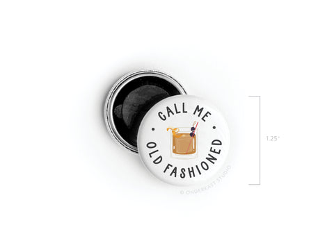 The Onderkast Studio Call Me Old Fashioned Button Magnet features a classic Old Fashioned illustration and the phrase circling the drink. This 1.25-inch round white magnet opens to reveal a black interior, adding vintage flair to your collection.