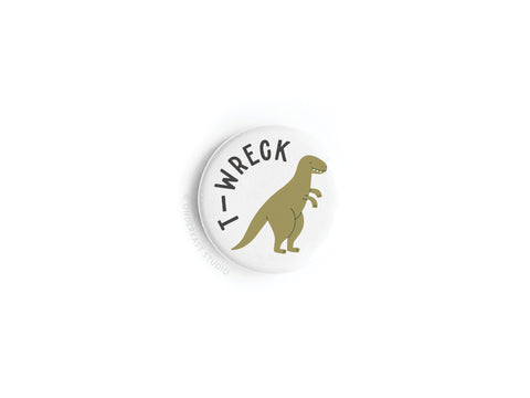 The Onderkast Studio T-wreck Button Magnet features a cartoon T-Rex with T-WRECK arched above in bold black letters, all vibrantly printed for an eye-catching, playful look. (DISCONTINUED).