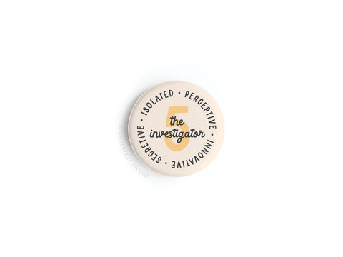 The Onderkast Studio Enneagram Button Magnet – 5 The Investigator is a round beige magnet featuring a bold number 5, “the investigator” in script, and traits like isolated, perceptive, innovative, and secretive—ideal for Type 5 personalities.