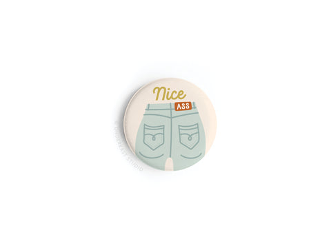 The Onderkast Studio Nice Ass Button Magnet features a playful denim jeans illustration with “Nice Ass” above and on the belt, celebrating body confidence and self-love on a crisp white background.