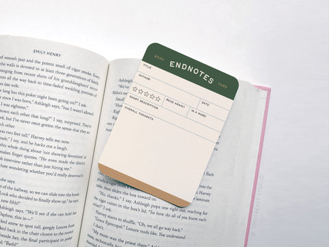The Onderkast Studio Endnotes Book Review Card Set features premium notepad-style bookmarks for tracking title, author, rating, reread status, and thoughts—each clipped to your book’s page for vibrant, organized reviews.