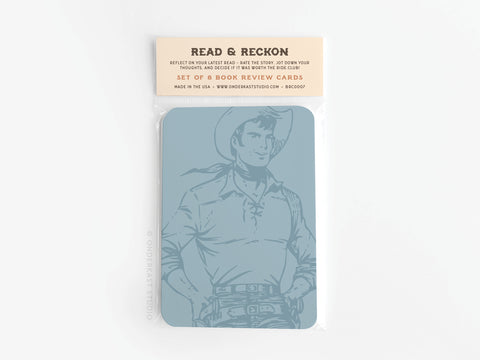 The Onderkast Studio Read & Reckon Book Review Card Set comes in a clear plastic sleeve with vibrant colors, an illustrated cowboy on the front, and includes 48 cards for reviewing books.