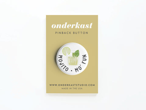The Mojito Mo’ Fun Pinback Button by Onderkast Studio features a colorful mojito illustration and MOJITO · MO FUN text, attached to a tan card labeled Onderkast Studio PINBACK BUTTON with website and Printed in the USA below.