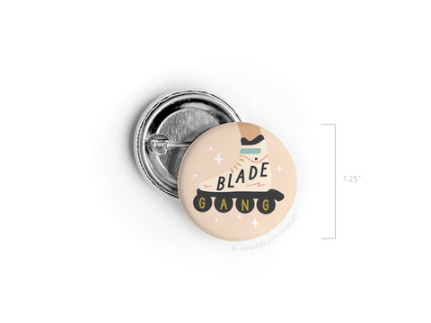 Show off your love for rollerblades with the Blade Gang Rollerblades Pinback Button by Onderkast Studio! This 1.25 round accessory features a playful roller skate and BLADE GANG in colorful letters—perfect for jackets and bags.