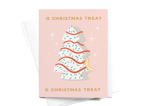The O Christmas Treat Greeting Card by Onderkast Studio features a festive illustration of a bitten Christmas tree cookie with icing, sprinkles, and red lines, plus “O CHRISTMAS TREAT” text above and below for holiday cheer.