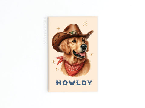 The Howldy Cowboy Dog Refrigerator Magnet by Onderkast Studio features a golden retriever in a cowboy hat and bandana with “HOWLDY” below—perfect for fans of Western charm.
