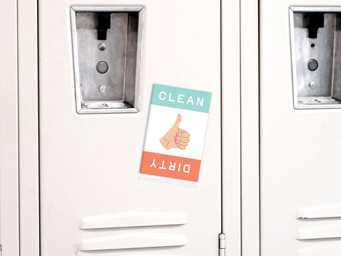The Onderkast Studio Dirty Clean Thumbs Up/Down Dishwasher Refrigerator Magnet, with split teal for CLEAN and red for DIRTY, offers an easy way to display cleaning status at a glance—just place it sideways on any locker or appliance.