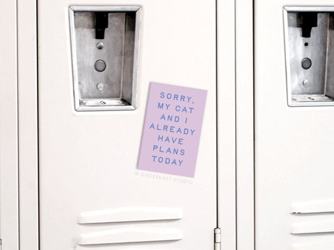 The Onderkast Studio My Cat and I Refrigerator Magnet features light purple text on white: Sorry, my cat and I already have plans today—a whimsical accent for your fridge that celebrates feline companionship.