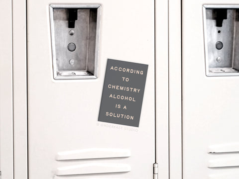 An Onderkast Studio Alcohol Is a Solution Refrigerator Magnet decorates a white locker with vents and handles, creating playful, chemistry-themed humor.