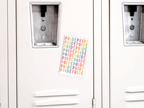 A white locker with an Onderkast Studio Pride Refrigerator Magnet on the door. The magnet spells PRIDE in vibrant, multicolored rows, showing LGBTQ+ support. The locker also has a metal lock slot and handle.