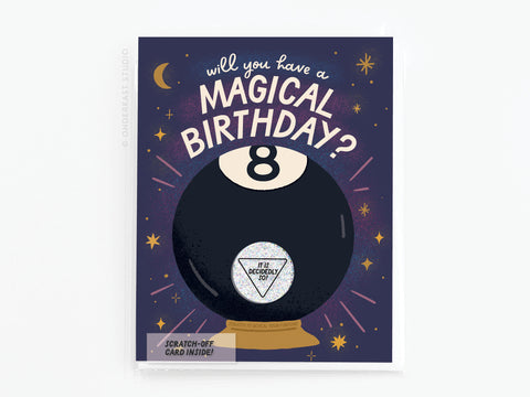 The Magic 8-Ball Birthday Scratch-Off Greeting Card by Onderkast Studio features a playful 8-Ball and the question Will you have a magical birthday? with stars, a crescent moon, and the answer It is decidedly so! on a purple background.
