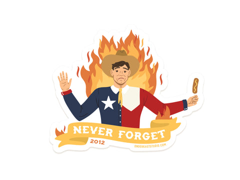 The Onderkast Studio Never Forget Blazing Big Tex Sticker features a sad man in a Texas flag shirt and cowboy hat with flames and a corn dog, plus a “NEVER FORGET 2012” banner—perfect vinyl sticker for quirky Texas history fans!.