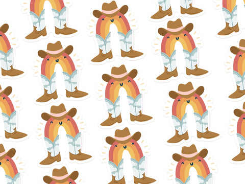 The Rainbow Cowboy Sticker by Onderkast Studio features playful rainbows with smiling faces in cowboy hats, boots, and jeans on a white background—ideal for adding a fun western vibe to any durable vinyl surface.