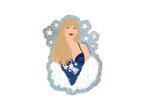 TS Midnights Glitter Sticker by Onderkast Studio features a woman with long blonde hair in a blue dress with snowflake details and a white fur stole, set against a sparkly star background—ideal for any Swiftie.