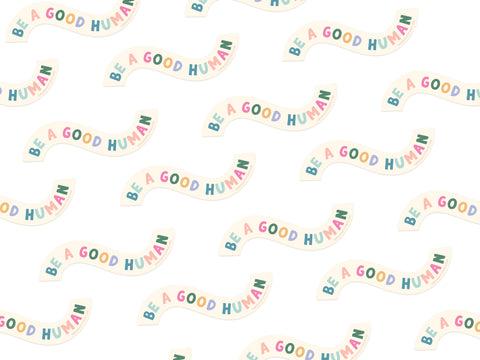 Featuring a repeating pattern of colorful letters spelling “Be A Good Human” on white, the Be A Good Human Sticker by Onderkast Studio is a playful, weatherproof vinyl design perfect for spreading positivity.