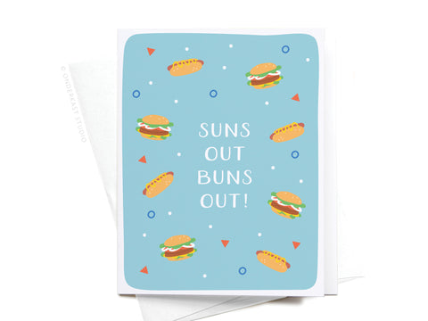 The Suns Out Buns Out! Greeting Card – FINAL STOCK by Onderkast Studio has a blue background with illustrated burgers, hot dogs, geometric shapes, and white center text: SUNS OUT BUNS OUT! for a premium feel.