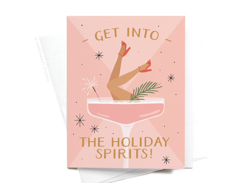 The Get Into the Holiday Spirits! Cocktail Greeting Card by Onderkast Studio features Get into the holiday spirits! with a festive pink cocktail, womans legs in red heels, sparkler, and greenery on a pink starry background.