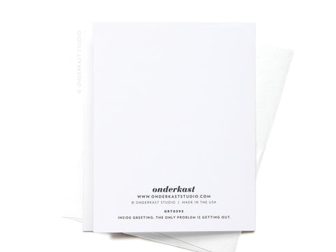 The Get Into the Holiday Spirits! Cocktail Greeting Card by Onderkast Studio rests on a matching envelope, with a premium feel. The back displays the brands logo and reads: INSIDE GREETING: THE ONLY PROBLEM IS GETTING OUT.