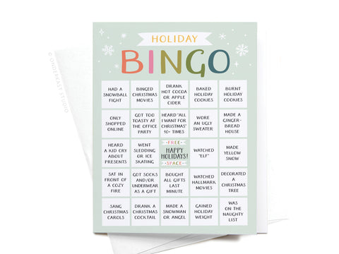 The Onderkast Studio Holiday Bingo Greeting Card features vibrant pastel prints of winter and Christmas activities, like caroling and baking, plus a central FREE—HAPPY HOLIDAYS!—SPACE for interactive joy.