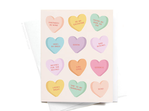 The Galentine’s Candy Hearts Greeting Card by Onderkast Studio features twelve pastel hearts with fun friendship sayings like PARTNERS IN WINE, BE MY GALENTINE, BESTIES FOR THE RESTIES, and XOXO.