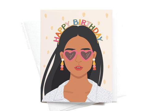 Illustration of a woman wearing a Happy Birthday headband, from Onderkast Studio, on a pale confetti background—perfect for an A2 size greeting card.