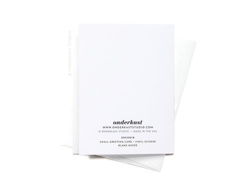 The Greetings From Texas Sticker Greeting Card by Onderkast Studio is a white card made from quality white cardstock, with black product details on the back. It’s shown on a white envelope against a white background.