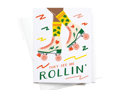 Featuring a person in cream roller skates with green lightning bolts and orange wheels, this dark They See Me Rollin Roller Blades Greeting Card by Onderkast Studio is ideal for skating fans and displays THEY SEE ME ROLLIN with colorful squiggles.