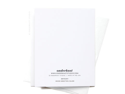 The “You’ll Always Be My Bestea” Greeting Card by Onderkast Studio rests atop a white envelope on a white background. The back features company details, and the inside is blank—ideal for any tea-loving friend.