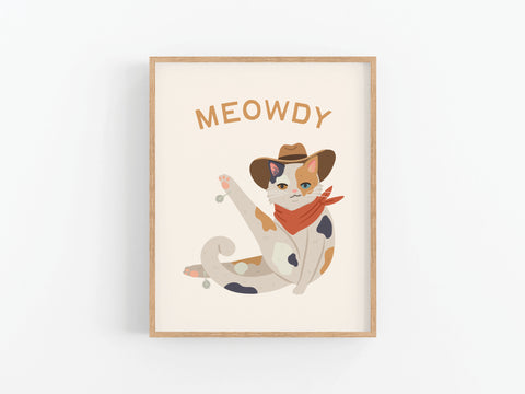 The Meowdy Cat Art Print by Onderkast Studio features a cat in a cowboy hat and red bandana with MEOWDY above, raising one paw. This framed print is a purrfect way to add character to any white wall for cat lovers.