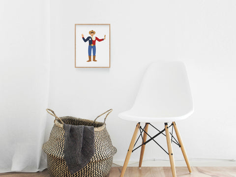 A white chair and woven basket rest on a wooden floor, with a framed Big Tex Art Print by Onderkast Studio—featuring the iconic State Fair mascot in his cowboy outfit—hanging on the white wall above.