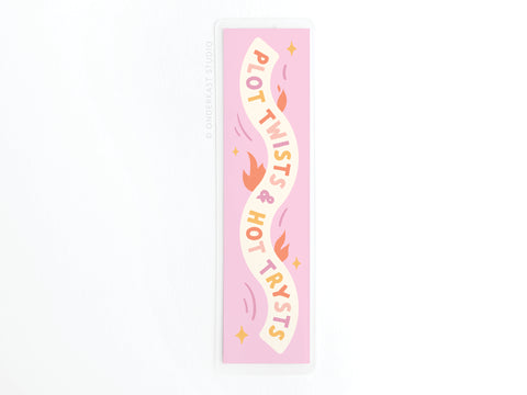 The Plot Twists & Hot Trysts Laminated Bookmark by Easyhand Goods features bold text on a pink rectangle with orange and red flames, durable lamination, and is printed in the USA.