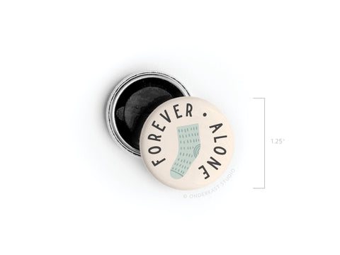The Forever Alone Sock Button Magnet by Onderkast Studio is a playful 1.25-inch round magnet with a bold design of a single sock and “FOREVER ALONE” text on the front, plus a visible metal back.