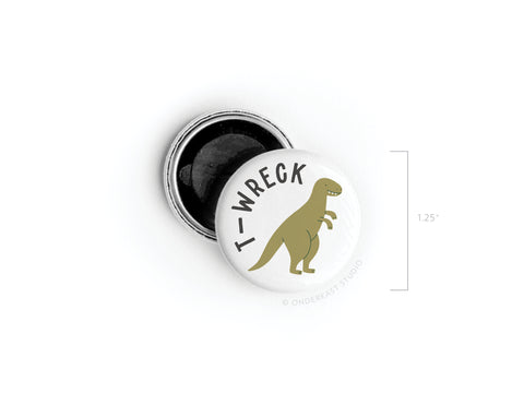 The T-wreck Button Magnet – DISCONTINUED by Onderkast Studio features a green T. rex and T-WRECK text. It measures 1.25, has bright, vibrant print, and an open back to display details.