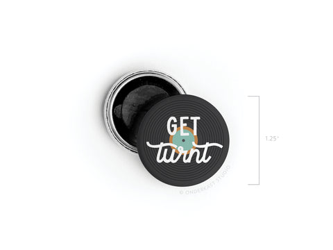 The Get Turnt Vinyl Button Magnet by Onderkast Studio is a 1.25-inch round black magnet with GET turnt in stylized text and a record design—a perfect high-quality accessory for music lovers.