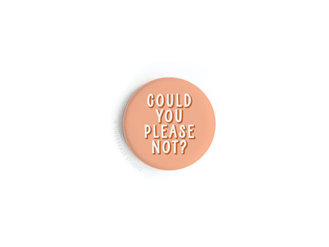 The Onderkast Studio Could You Please Not Button Magnet—now discontinued—is a round, peach-colored magnet with the phrase in bold white caps. Printed in the USA, it stands out on a plain white background.