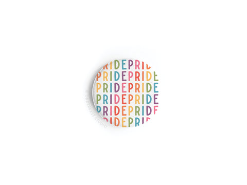 The Pride Button Magnet by Onderkast Studio displays the word PRIDE in vibrant rainbow colors, forming a colorful pattern on a white background.