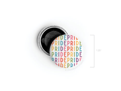 The Onderkast Studio Pride Button Magnet features vibrant repeating PRIDE rows, shown with its open silver backing and a 1.25-inch size—a bright symbol of inclusivity.