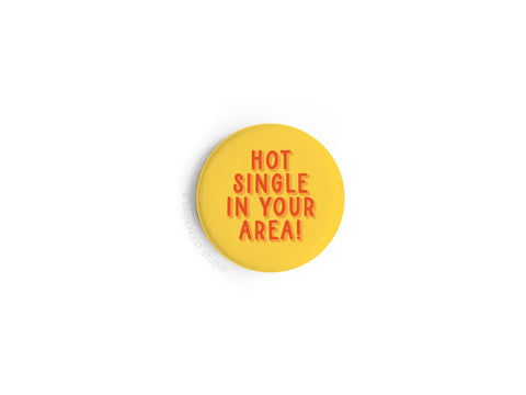 The Hot Single in Your Area! Button Magnet by Onderkast Studio features bold red text on yellow, making a hilarious gift. Printed in the USA.