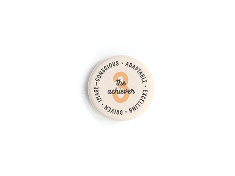 The Onderkast Studio Enneagram Button Magnet – 3 The Achiever features 3 The Achiever at the center, with traits like Image-conscious, Adaptable, Excelling, and Driven around the edge. Ideal for Type 3s. Plain white background.