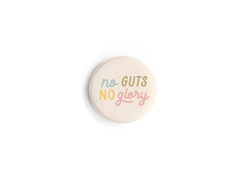 The No Guts No Glory Button Magnet by Onderkast Studio features “No Guts No Glory” in colorful lettering on white—a round beige magnet that adds bold motivation to any space.