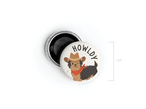 The Onderkast Studio Howldy Button Magnet is a 1.25 round, Western-inspired accessory with a small dog in a cowboy hat and red bandana under HOWLDY, printed in vibrant colors for charm.