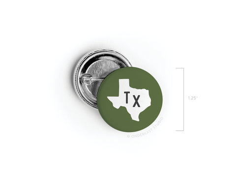 Show your Texas pride with the Dark Green TX Pinback Button by Onderkast Studio. Printed in the USA, this 1.25 round button features a bold black TX on a white Texas silhouette against a dark green background.