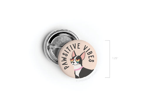 The Pawsitive Vibe Dog Pinback Button by Onderkast Studio is a 1.25 high-quality pin featuring a stylish dog with sunglasses and PAWSITIVE VIBES text.