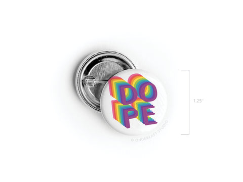 The Onderkast Studio DOPE Pinback Button features bold, 3D rainbow letters on a white background and measures about 1.25 inches in diameter.