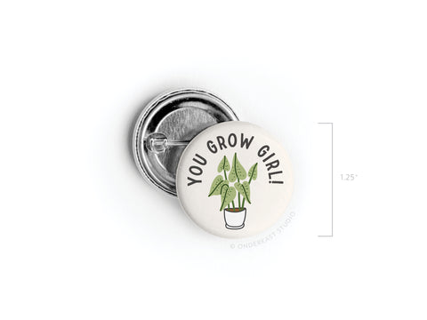 The Onderkast Studio You Grow Girl! Houseplant Pinback Button features a potted plant illustration with the phrase YOU GROW GIRL! above it. Measuring 1.25 in diameter, it’s perfect for plant lovers and enthusiasts.