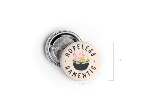 Show off your love for noodles with the Hopeless Ramentic Pinback Button by Onderkast Studio—this 1.25 round accessory features Hopeless Ramentic above a bowl of ramen, chopsticks, hearts, and a soft-boiled egg.