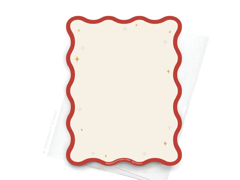The TS Red Wavy Die Cut Notecard by Onderkast Studio features a cream, die-cut card with a red wavy border and gold star accents on a white envelope—a pop culture-inspired touch for any Taylor Swift fan.
