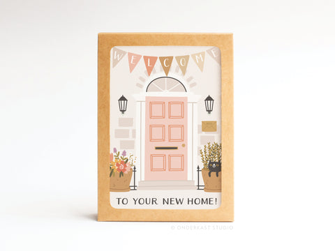 The Onderkast Studio Welcome to Your New Home Door Folded Greeting Note Set of 10 features a pink door, potted plants, WELCOME banner, and TO YOUR NEW HOME! text on premium cardstock with vibrant print.